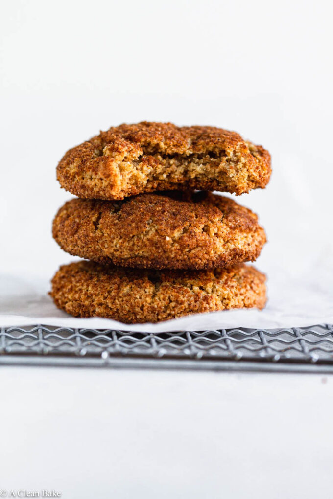 Three gluten free snickerdoodles stacked on top of one another