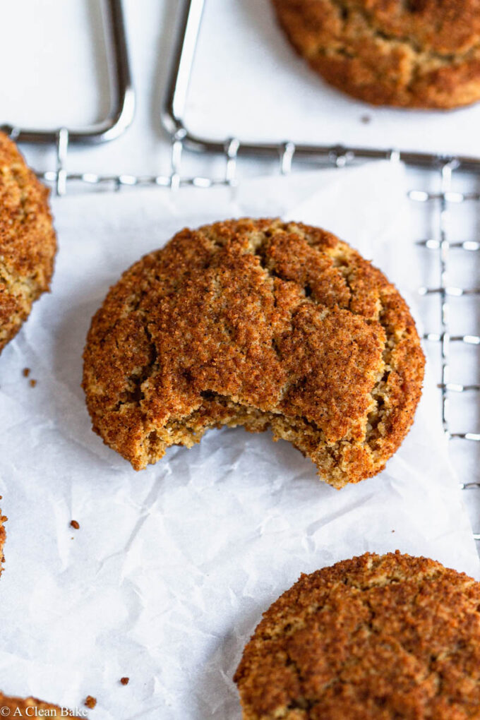 Gluten Free snickerdoodle on a cooling rack with a bite taken out of it