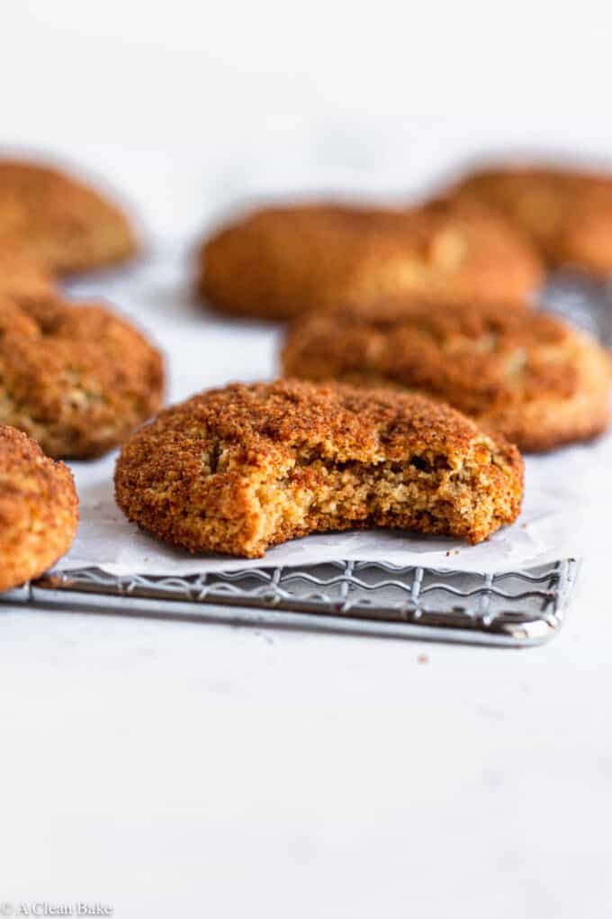 Gluten Free snickerdoodle on a cooling rack with a bite taken out of it