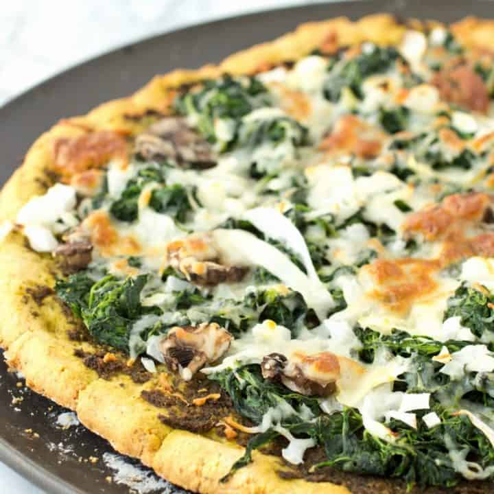 Grain Free Thin Crust Pizza topped with Homemade Pesto and Veggies (gluten-free and paleo)