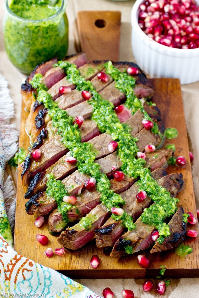 This juicy flank steak is drizzled with homemade chimichurri and plump pomegranate seeds for a simple, flavorful dinner! (gluten free, paleo and low carb)