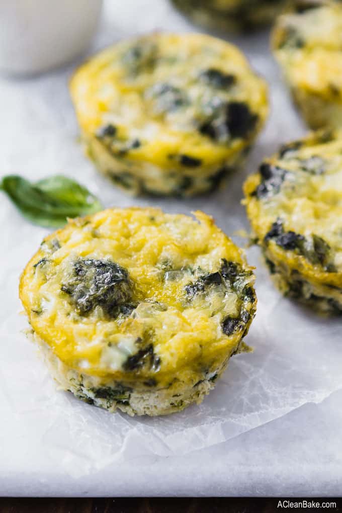 Mini frittatas with spinach are one of the best healthy, fast, and portable breakfast! This make-ahead frittata recipe is super freezer friendly. Just grab one out of the freezer on a busy morning, and you're set! These are #glutenfree, #paleo, #Whole30 (if you omit the cheese), and #lowcarb. #glutenfreerecipe #glutenfreebreakfast #healthyrecipe #healthybreakfast #paleobreakfast #paleorecipe #lowcarbrecipe #lowcarbbreakfast