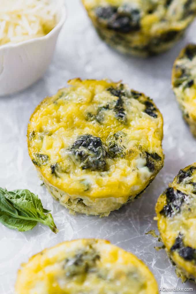 Mini frittatas with spinach are one of the best healthy, fast, and portable breakfast! This make-ahead frittata recipe is super freezer friendly. Just grab one out of the freezer on a busy morning, and you're set! These are #glutenfree, #paleo, #Whole30 (if you omit the cheese), and #lowcarb. #glutenfreerecipe #glutenfreebreakfast #healthyrecipe #healthybreakfast #paleobreakfast #paleorecipe #lowcarbrecipe #lowcarbbreakfast