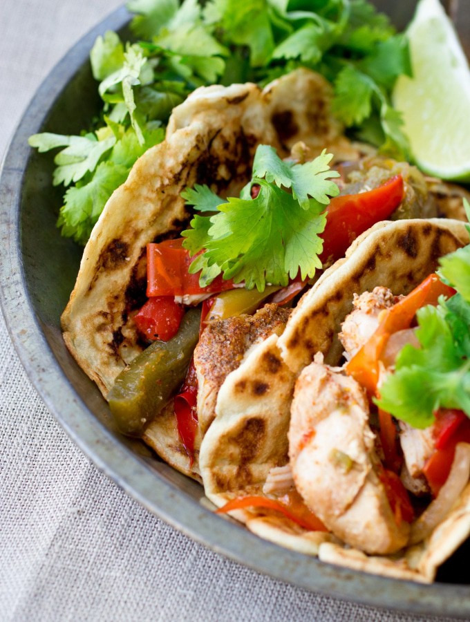Easy, healthy chicken fajitas that are made in the slow cooker with all-natural (fast and easy) homemade fajita seasoning! (gluten free, grain free, paleo friendly, low carb)