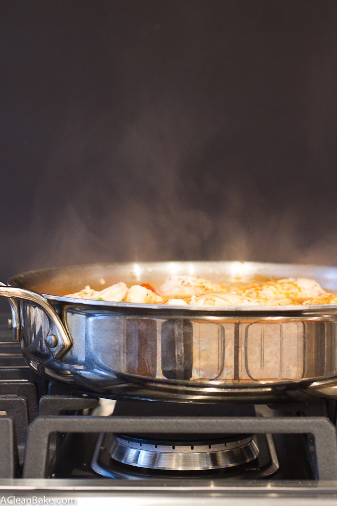 30 Minutes and one pan is all it takes to make paella for dinner tonight! And no, you don't need a special paella pan - don't worry. Bonus: It's naturally gluten free, too!