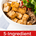 5 ingredient baked tofu makes dinner easy! Whip up this easy protein to enjoy alongside noodles, Buddha Bowls, or your favorite healthy meal. #glutenfree #vegan #glutenfreerecipe #glutenfreedinner #veganrecipe #vegandinner #healthyrecipe #healthydinner #easydinner #easyhealthydinner #healthydinnerideas
