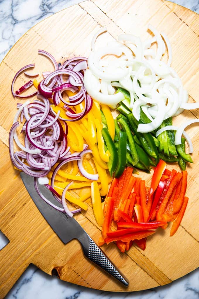 Ingredients on a cutting board for slow cooker crockpot chicken fajitas