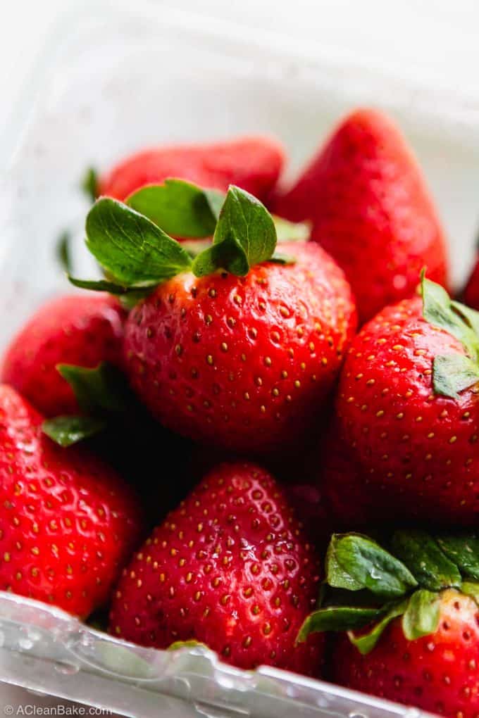 Container of ripe strawberries for homemade pink drink recipe