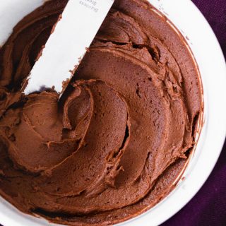 This is the BEST Chocolate Buttercream Frosting Recipe you'll try. It's made with less sugar, so the chocolate flavor shines through! The texture is rich and silky. Everyone loves this easy chocolate buttercream frosting! #glutenfree #cakes #cakedecorating #frosting #dessert #dessertrecipe #dessertrecipes #cakerecipe #cakerecipes