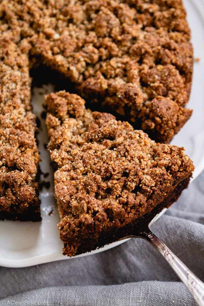 Spatula serving piece of paleo blueberry crumb cake