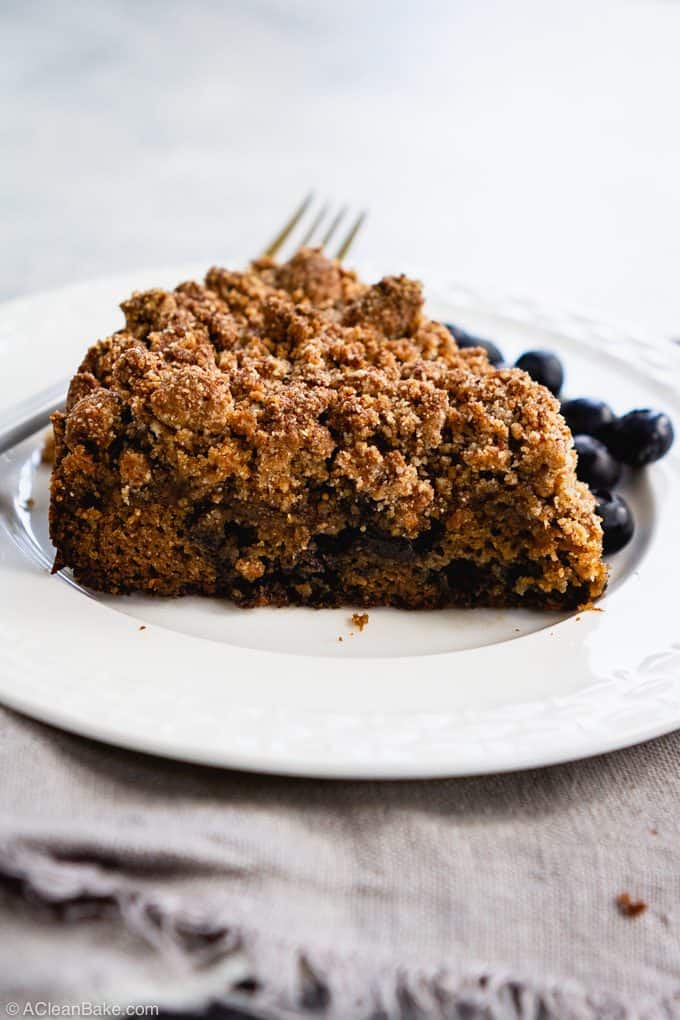 Slice of paleo blueberry crumb cake on a plate