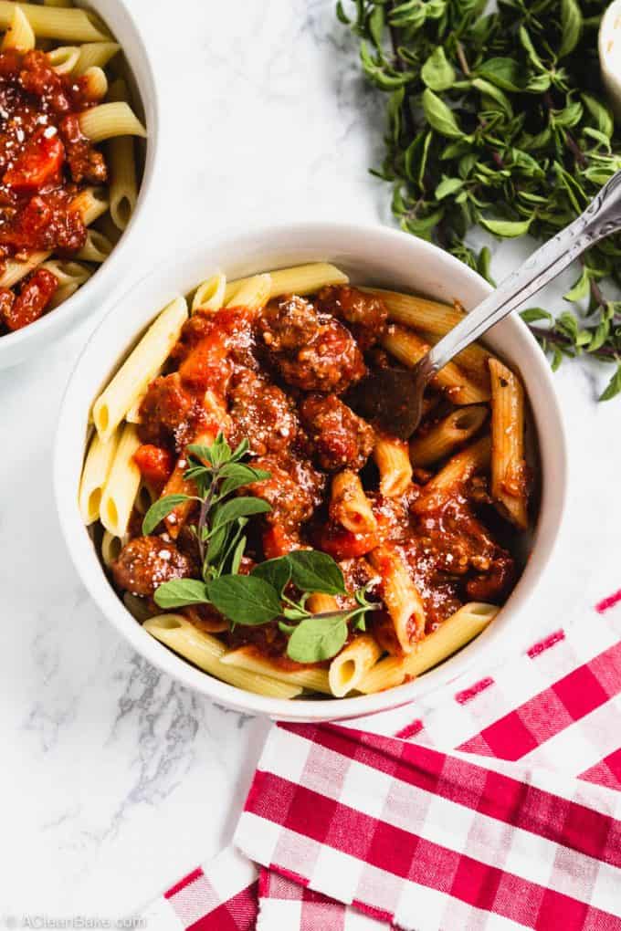 Slow Cooker Bolognese Sauce in a Bowl with a fork