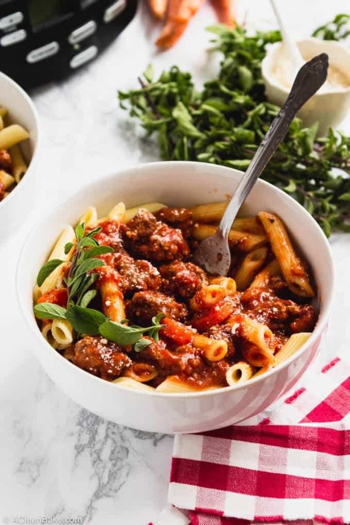 Slow Cooker Bolognese Sauce in a Bowl with a fork