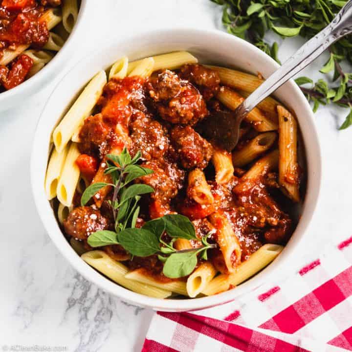 Slow Cooker Bolognese Sauce in a Bowl with a fork