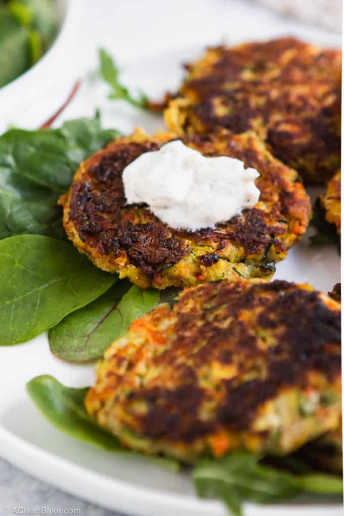 Close up of paleo gluten free vegetable fritter with yogurt sauce