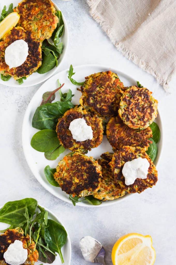 Plate of gluten free vegetable fritters with yogurt sauce