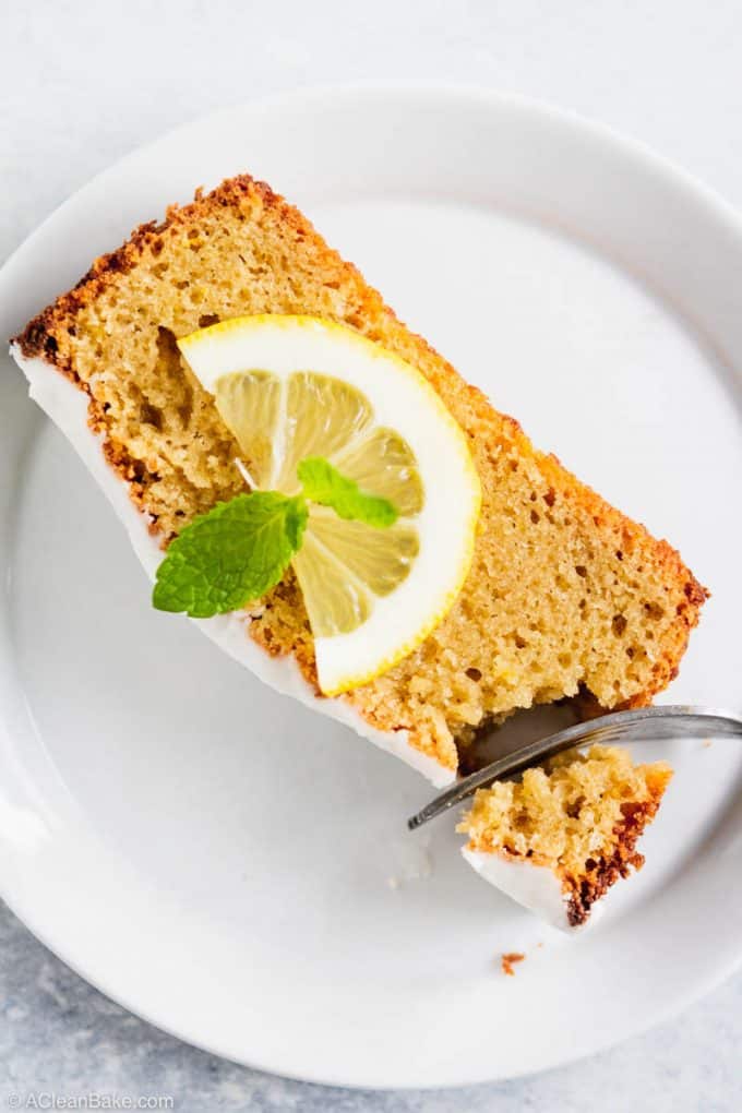 Slice of gluten free and paleo lemon pound cake on a plate with a fork