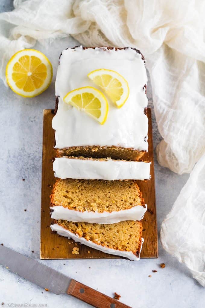 Sliced loaf of paleo and gluten free lemon pound cake on a cutting board