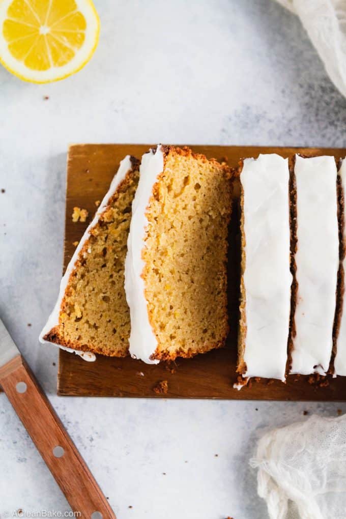 Sliced loaf of paleo and gluten free lemon pound cake on a cutting board