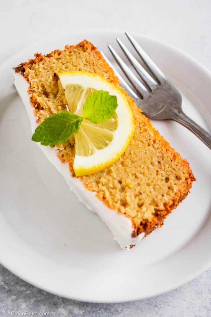 Slice of gluten free and paleo lemon pound cake on a plate with a fork