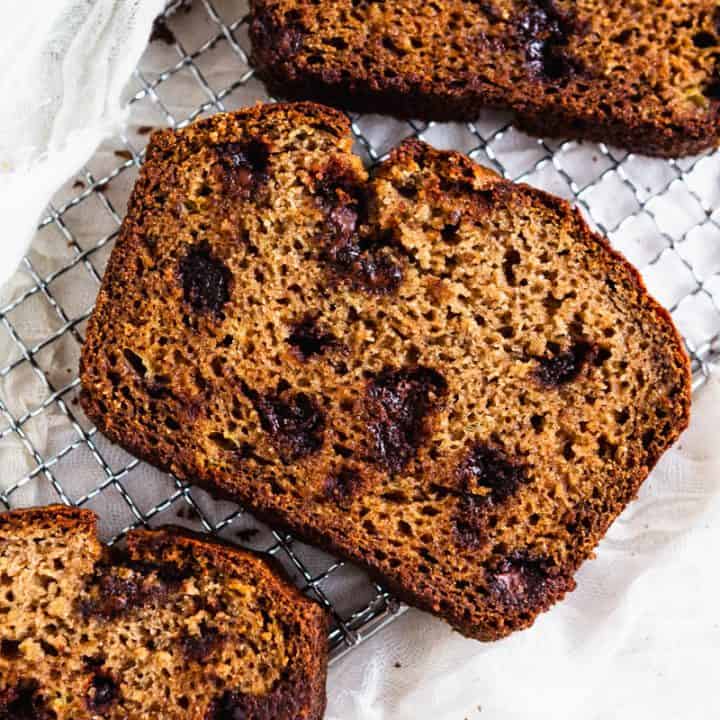 Slices of paleo gluten free banana bread on a cooling rack