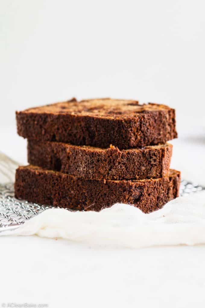 Stack of slices of paleo gluten free banana bread on a cooling rack