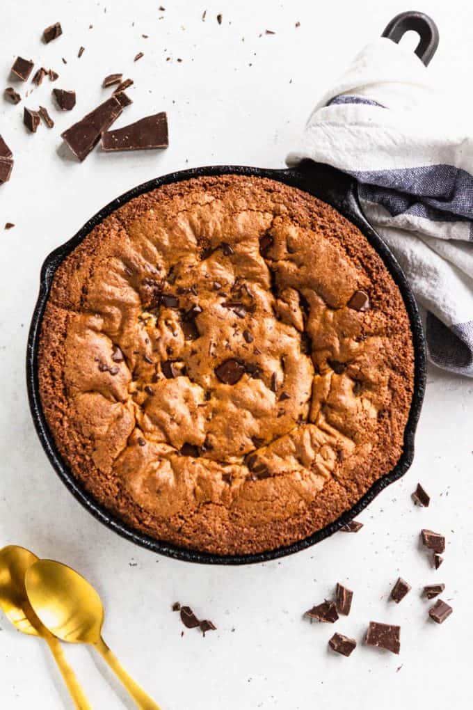 Deep dish chocolate chip skillet cookie (gluten free and paleo) in a skillet