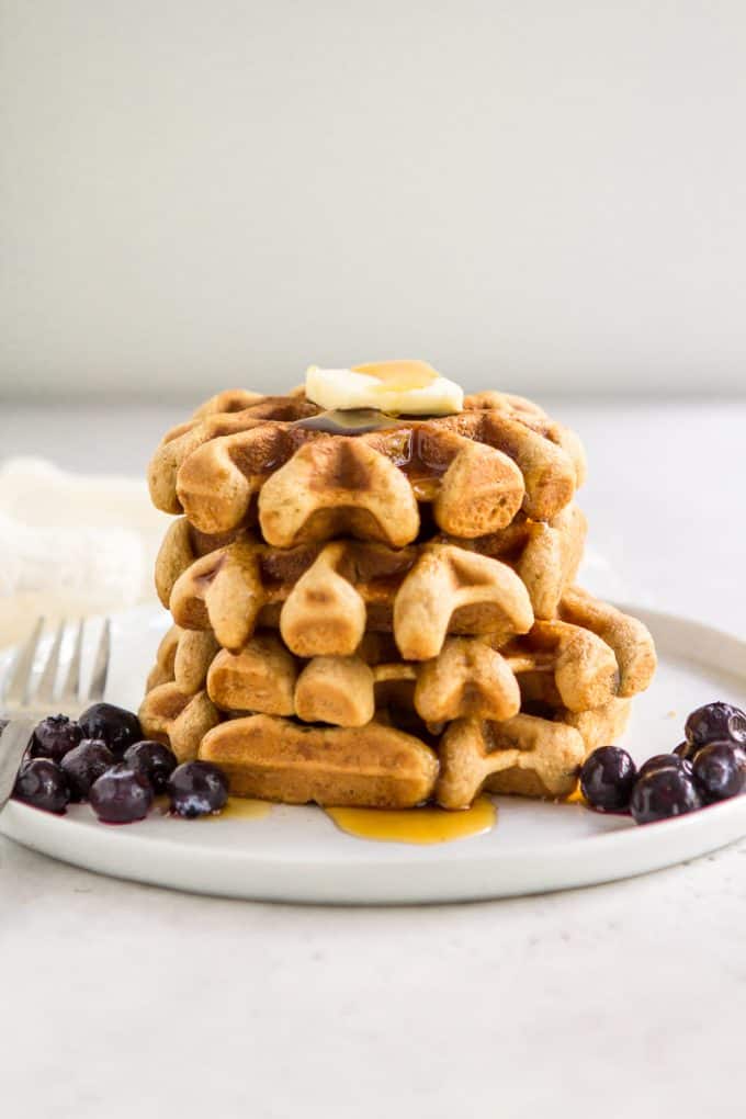 Stack of paleo gluten free waffles on a plate