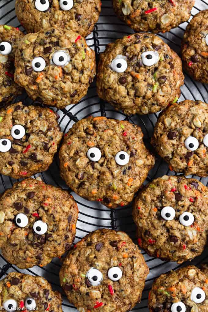 Gluten Free Monster Cookies with Candy Eyes arranged on a cooling rack