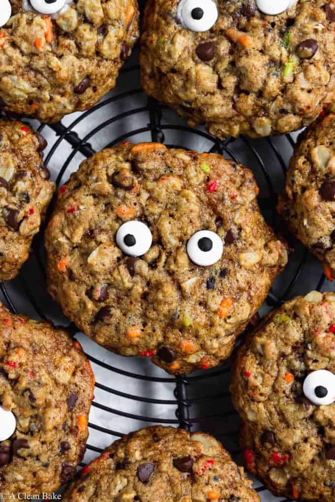 Gluten Free Monster Cookies with Candy Eyes arranged on a cooling rack- Close Up Shot