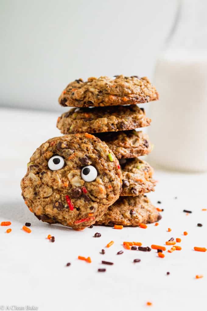 Gluten Free Monster Cookies stacked on a white table