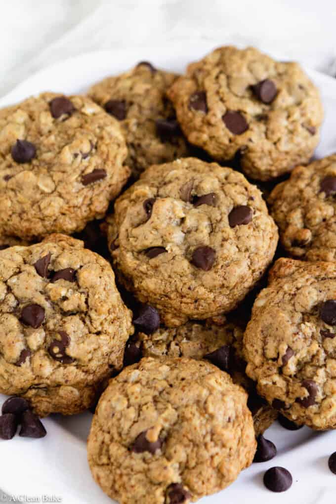 Pile of gluten free oatmeal chocolate chip cookies on a plate