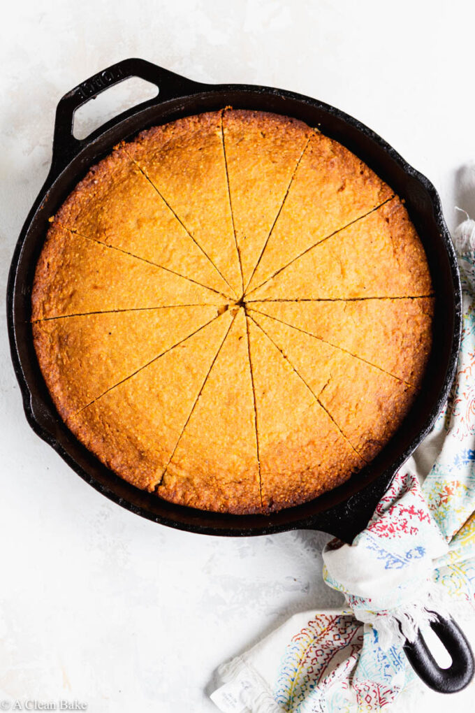 Sliced gluten free cornbread in a skillet