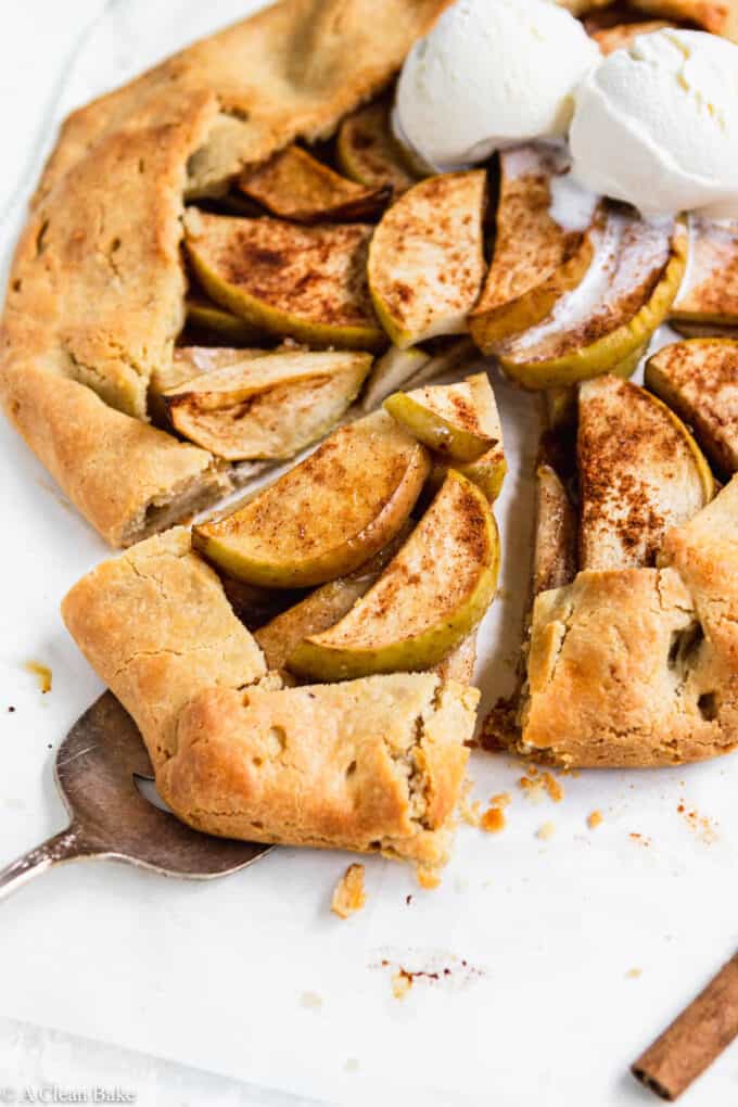 slice of paleo gluten free apple galette being removed from the pie