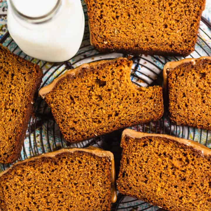 Slices of paleo gluten free pumpkin bread on a cooling rack