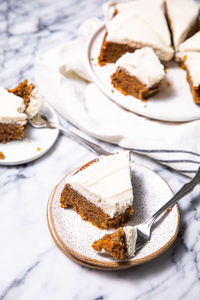 Gluten Free Paleo Zucchini Cake sliced up on a marble table