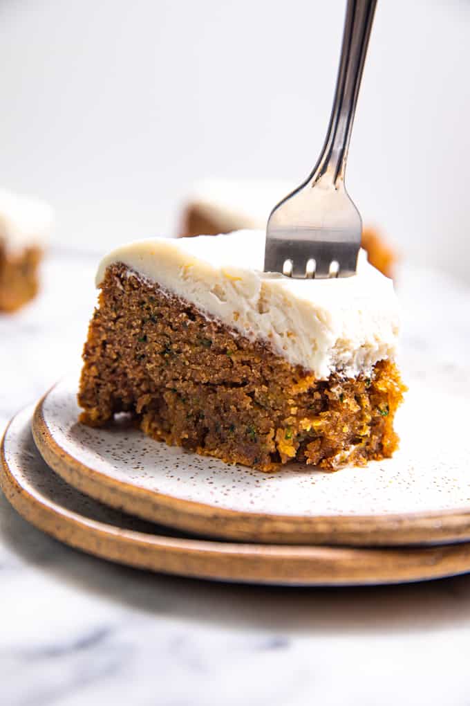 A Slice of Gluten Free Paleo Zucchini Cake on a plate with a fork