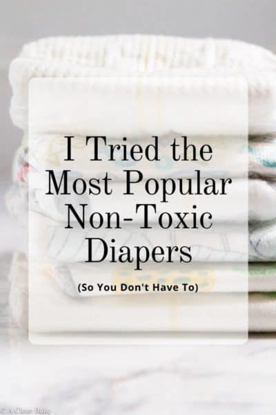 Pile of folded diapers with overlay text "I tried the most popular Non-Toxic Diapers so you don't have to"